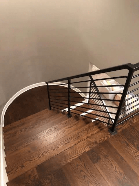Staircase done with hardwood floor installation by Husker Hardwood Floors in Omaha.